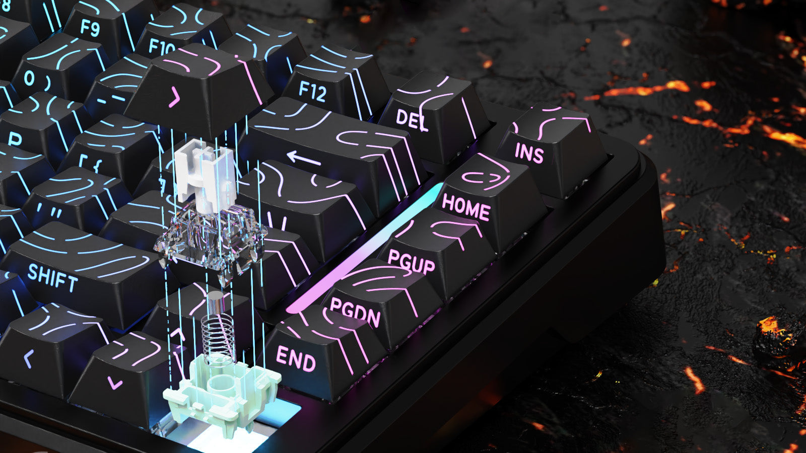 Attack Shark branded gaming keyboard with vibrant RGB lighting displaying a circuit-like pattern on black keycaps. The keyboard features orange brand tags on both sides and is displayed against a dark background with glowing red lava-like elements