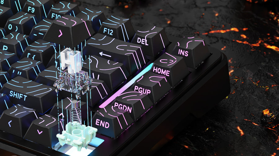 Attack Shark branded gaming keyboard with vibrant RGB lighting displaying a circuit-like pattern on black keycaps. The keyboard features orange brand tags on both sides and is displayed against a dark background with glowing red lava-like elements
