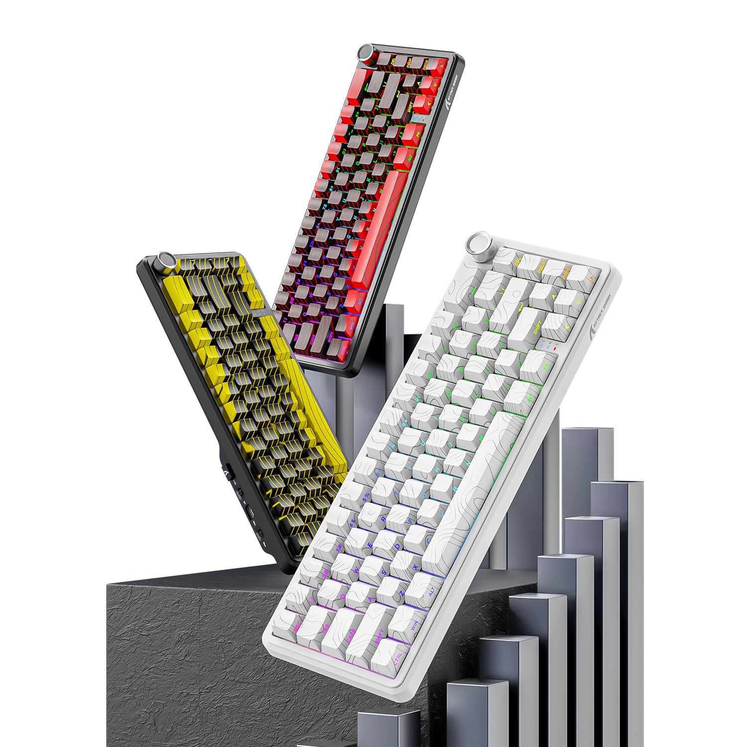 Three Attack Shark X65PRO HE keyboards in white, yellow, and red, featuring RGB backlighting and a modern design.
